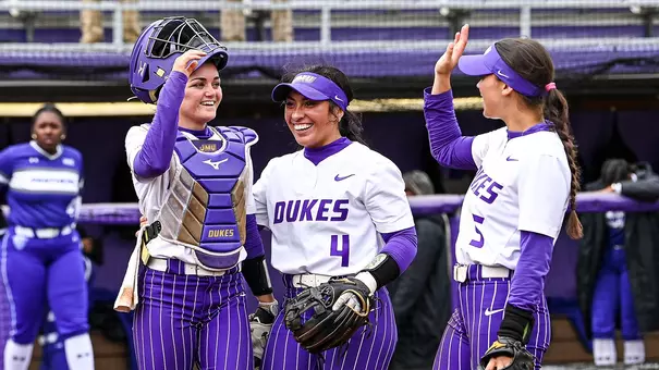 James Madison softball players celebrating series win over Georgia State