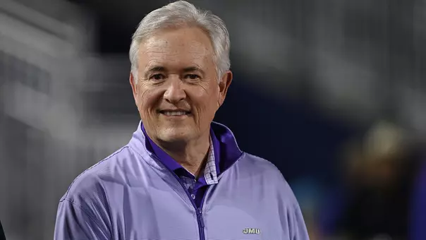 Jeff Bourne poses for a candid photo during retirement recognition at a JMU football game
