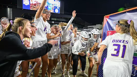 JMU Lacrosse celebrates after defeating ECU in the 2026 American Conference Women's Lacrosse Championship