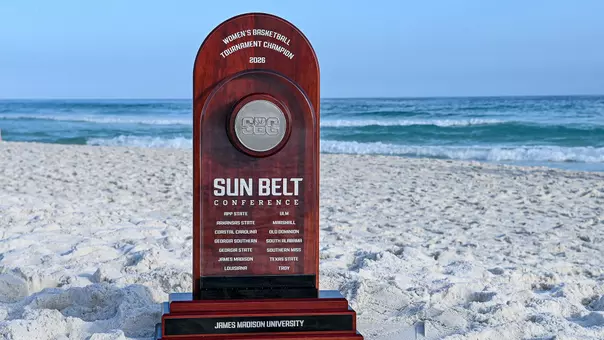 2026 Sun Belt women's basketball trophy on beach