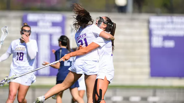 JMU celebrates after scoring during its 13-7 win over Georgetown.
