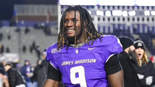 Xavier Holmes celebrates in JMU's Sun Belt title win over Troy.