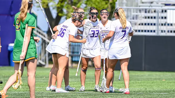 Payton Root celebrates a goal with her teammates during JMU's first-round win over Notre Dame.