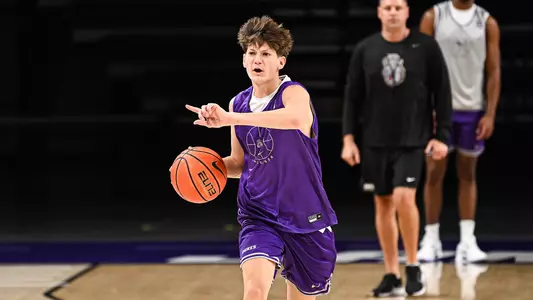 Matthew Owens dribbles up the floor during a JMU basketball practice