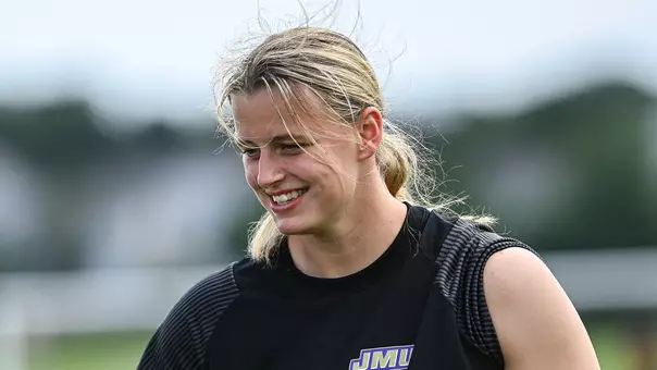 Ginny Lackey talking with teammates during a JMU womens soccer practice