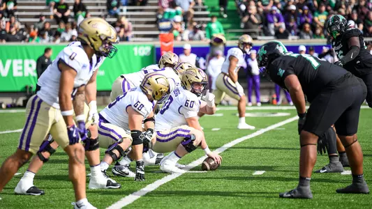 Zach Greenberg calling out signals at the line of scrimmage versus Marshall.