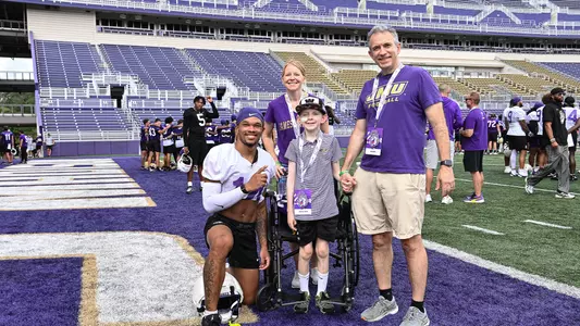 KJ Flowe posing with John Paul after practice at Bridgeforth Stadium.