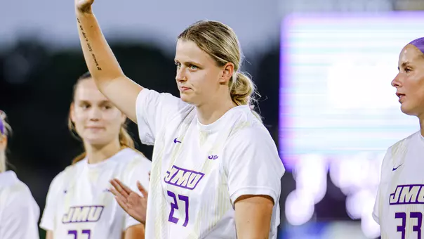 Ginny Lackey waves to the fans during starting lineup introductions
