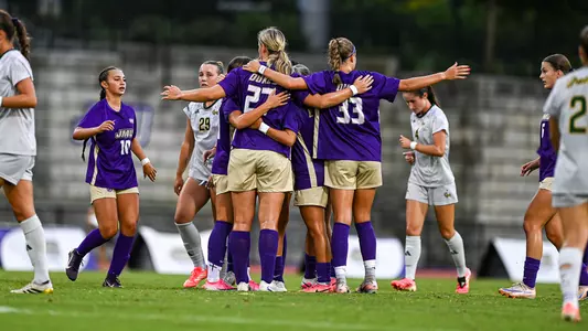 JMU Womens Soccer celebrates after scoring a goal against George Mason