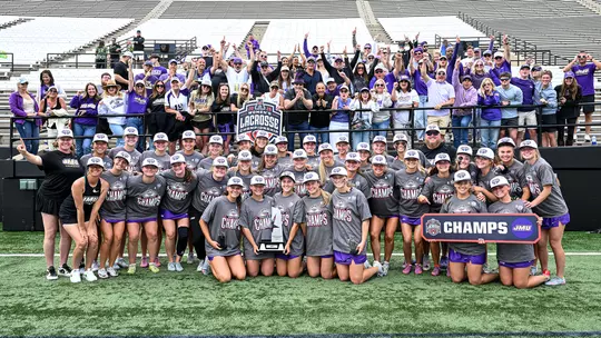JMU Lacrosse poses for a phot after winning the 2026 American Conference Women's Lacrosse Championship