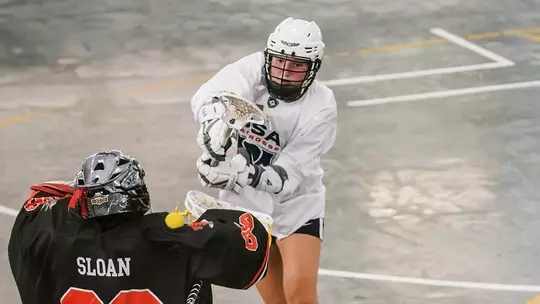 Olivia Mattis representing the USA in the world lacrosse games