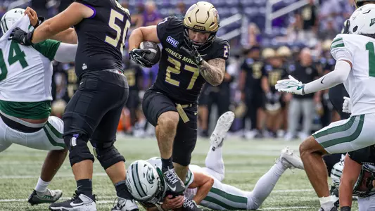Phoenix Donghia rushes for a touchdown against Wagner