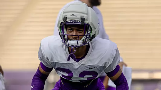 Trey Gibson lines up on defense during a JMU football practice