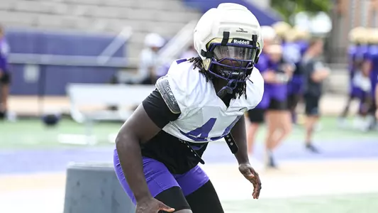 Kacey Gilliam participates in a drill during a JMU football practice