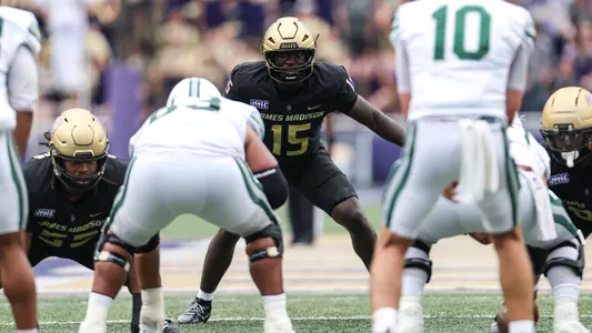 JT Hooten lining up on defense ahead of a snap against Wagner