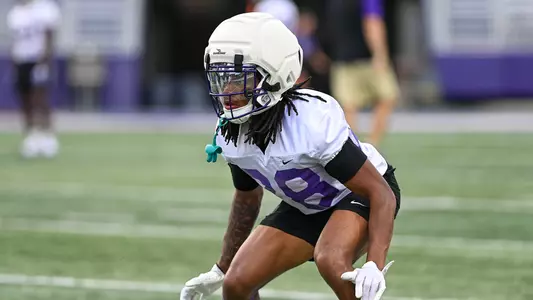 Kamden Jennings drops into coverage during a JMU football practice