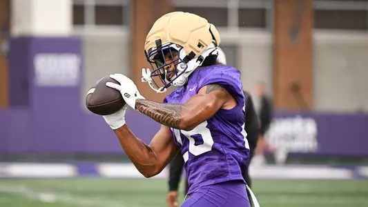 Micah Matthews makes a catch during a JMU football practice