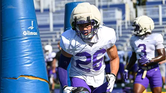 Josiah Perry participates in a drill during a JMU football practice