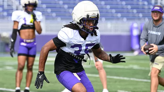 Joshua Prince participates in a drill during a JMU football practice