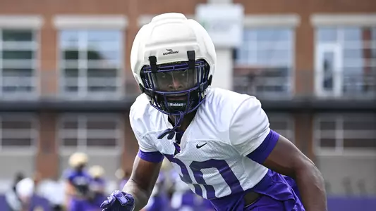 D'Kwan Thomas drops into coverage during a JMU football practice