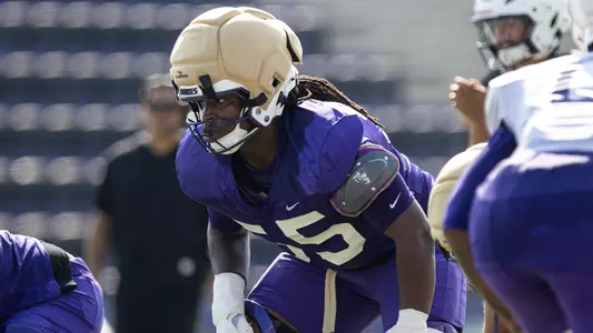 JaKobe Campbell lines up ahead of a drill during a JMU football practice