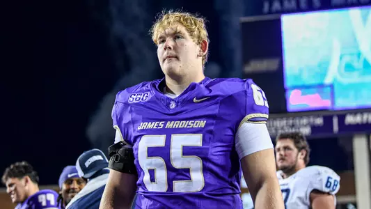 Parker Cunningham walks off the field following JMU's game against ODU