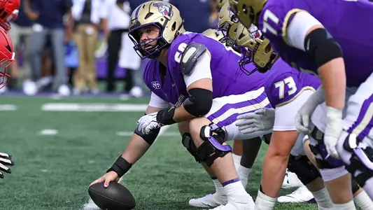 Zach Greenberg prepares to snap the ball against Liberty