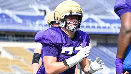 Kaedin Massey participates in a drill during a JMU football practice