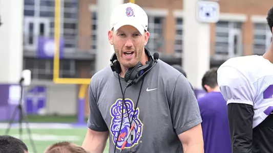 Dave Plungas coaches the defense during a JMU football practice