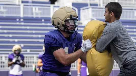 Max Roche participates in a drill during a JMU football practice
