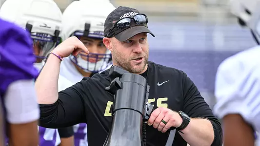 Rob Wenger coaches the special teams unit during a JMU football practice