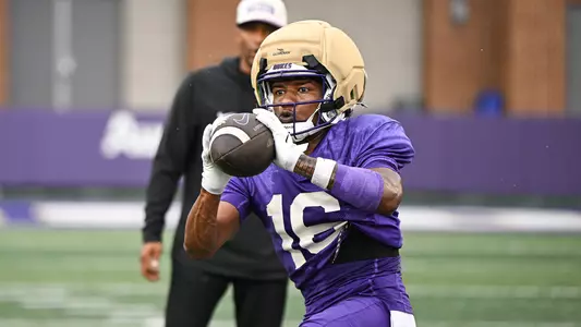 Arrion Concepcion makes a catch during a JMU football practice