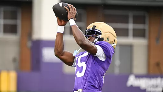 Elijah Moss makes a catch during a JMU football practice