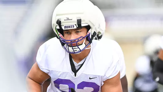 Grayson Gilmore participates in a drill during JMU football practice