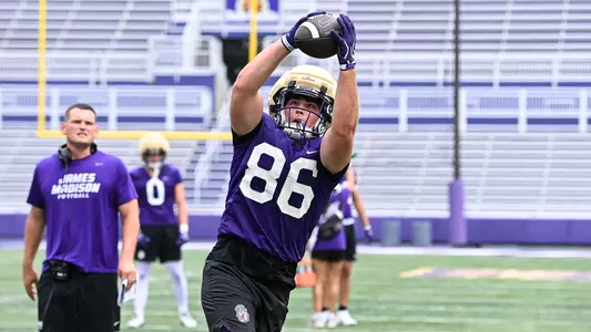 Ethan Gurela makes a catch during a JMU football practice