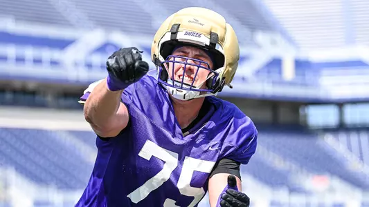 Wyatt Maines participates in a drill during a JMU football practice