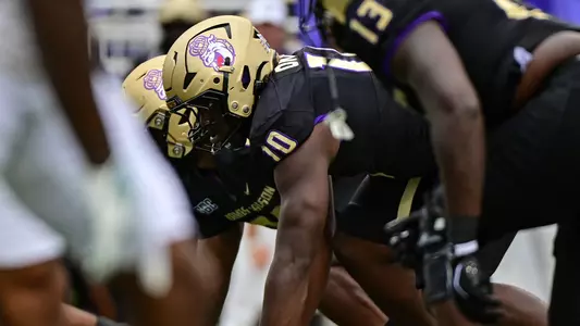 Chuk Okeke lines up ahead of a play against Wagner