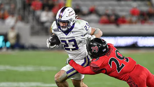 Nick Herman breaks a tackle during a run at San Diego State