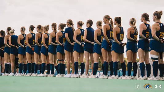 The field hockey team lining up for the national anthem pregame against Penn State