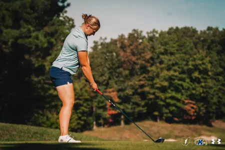 Gracie Larsen getting ready to drive a ball of the tee