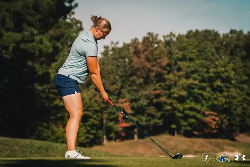 Gracie Larsen getting ready to drive a ball of the tee