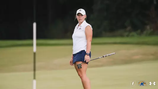 Aryn Matthews looking on as she puts onto the green