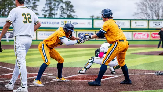 Micah Reinstra-Kiracofe and Ripken Reese celebrate at Southeastern Louisiana