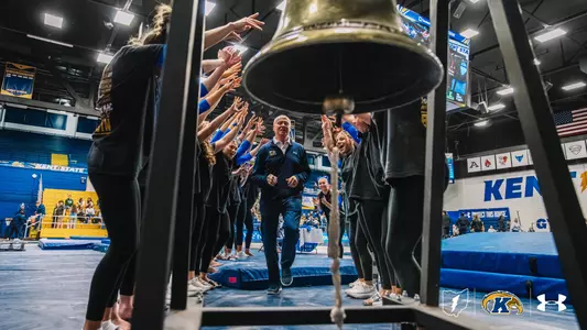 Brice Biggin walks to ring the victory bell