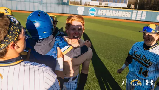 Kolton Schaller and baseball team celebrating after win