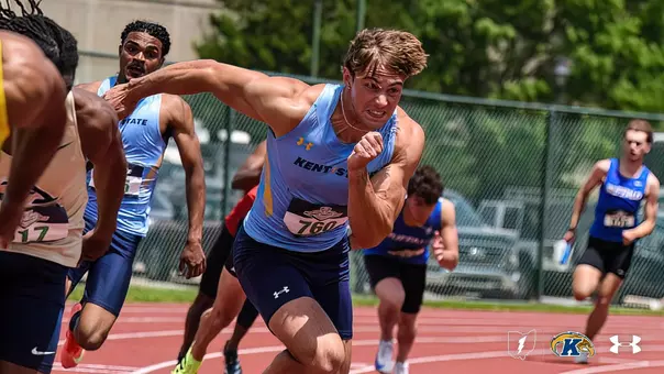 Kent State sprinter Ryan Gruss, wearing a light blue uniform and bib number 760, takes off as part of the baton exchange in the 4x100 relay race at the 2025 MAC Outdoor Track and Field Championships, with teammates and competitors visible in the background.