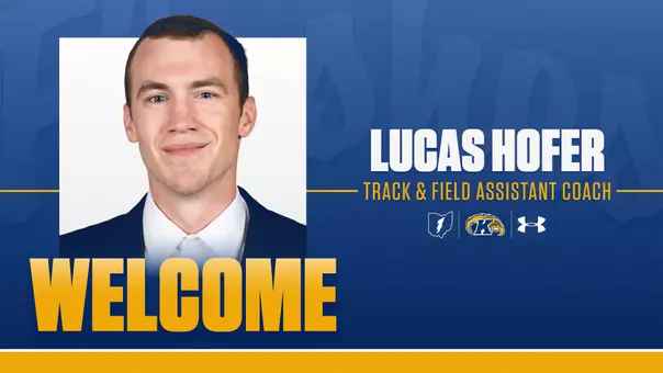 A Kent State Athletics welcome graphic on a royal blue background announcing Lucas Hofer as Track & Field Assistant Coach.A Kent State Athletics welcome graphic on a royal blue background announcing Lucas Hofer as Track & Field Assistant Coach. A headshot of Hofer — a young man in a navy blazer and white dress shirt — appears on the left alongside the word "WELCOME" in large gold letters. On the right, his name appears in bold white text above his title in gold, with the Ohio outline logo, Kent State Golden Flashes logo, and Under Armour logo displayed below.