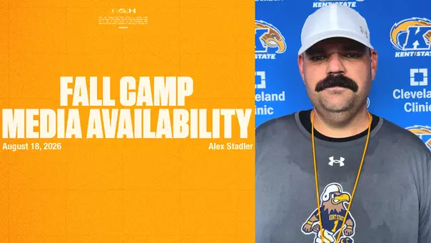 A split-screen graphic for Kent State Football's Media Availability on August 18, 2026. The left side features a textured gold background with text listing Alex Stadler. The right side shows a portrait of a coach with a mustache wearing a white cap and gray t-shirt in front of a blue branded backdrop.
