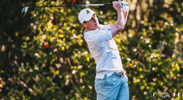 Darcy Hogg chipping with an iron
