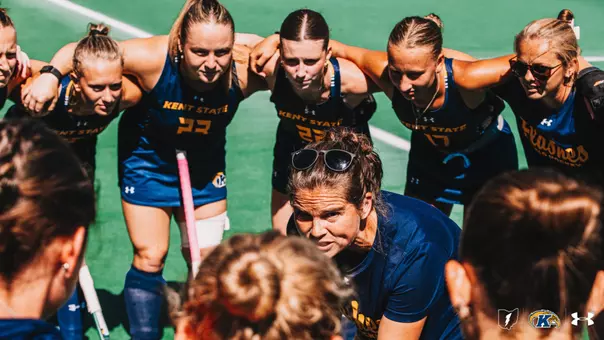 Field Hockey team huddling together before a conference game against Central Michigan